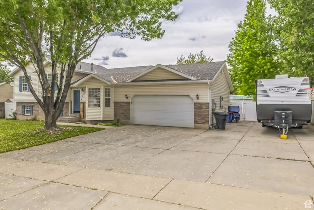 1135 E 220 N, Heber City, UT 84032 - view of front of house featuring driveway, a garage, brick siding, and a shingled roof