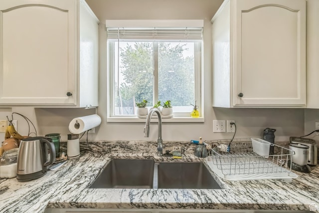1135 E 220 N, Heber City, UT 84032 - kitchen featuring a sink, white cabinets, and light stone countertops
