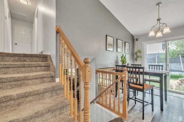 1135 E 220 N, Heber City, UT 84032 - stairs with wood finished floors, lofted ceiling, and a chandelier