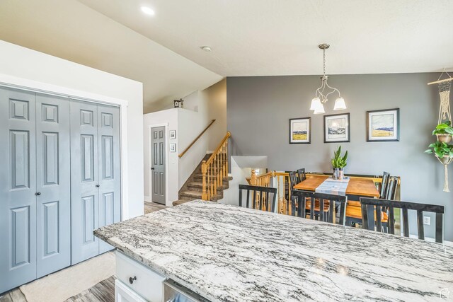 1135 E 220 N, Heber City, UT 84032 - kitchen with lofted ceiling, decorative light fixtures, white cabinets, and a chandelier