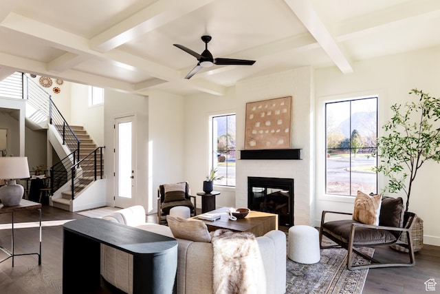 5348 W 10700 N Unit 2, Highland, UT 84003 - living area with coffered ceiling, healthy amount of natural light, wood finished floors, a fireplace, and beam ceiling