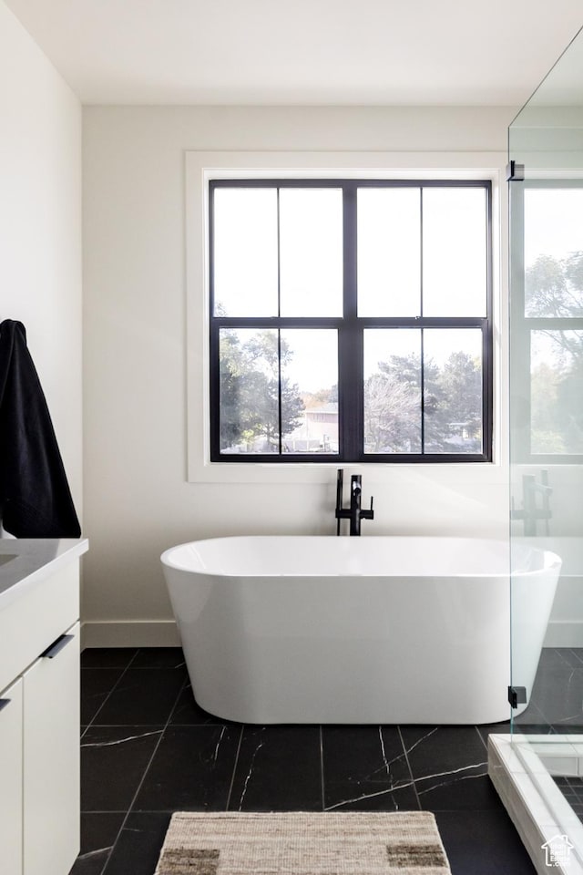 5348 W 10700 N Unit 2, Highland, UT 84003 - bathroom featuring vanity and a soaking tub