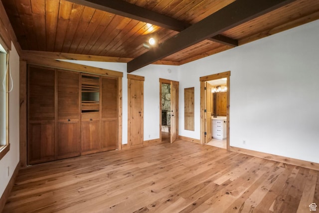 365 Parkview Dr, Summit Park, UT 84098 - unfurnished bedroom featuring light wood-style floors, baseboards, wood ceiling with exposed beams, multiple closets, and connected bathroom