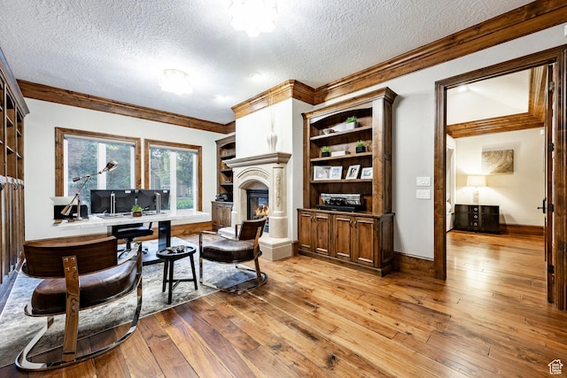 2177 W 9240 S, West Jordan, UT 84088 - living room with a textured ceiling, ornamental molding, light wood-type flooring, a large fireplace, and baseboards
