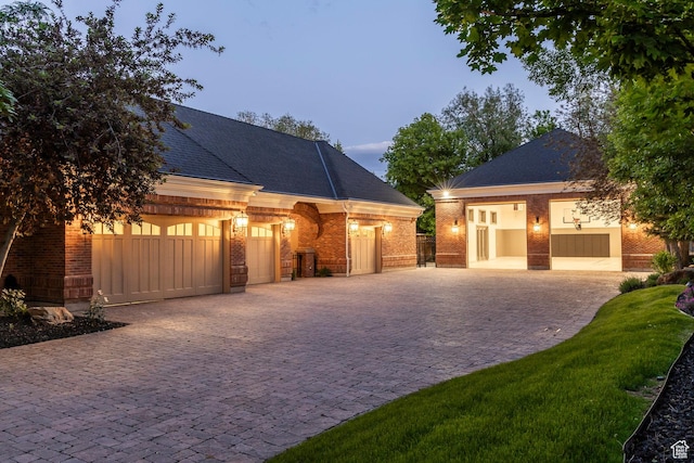 2177 W 9240 S, West Jordan, UT 84088 - view of front of property with decorative driveway, an attached garage, and brick siding