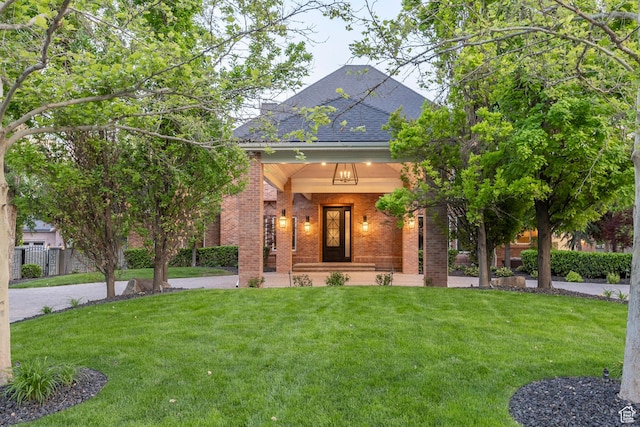 2177 W 9240 S, West Jordan, UT 84088 - view of front of house featuring brick siding, a front yard, and a shingled roof