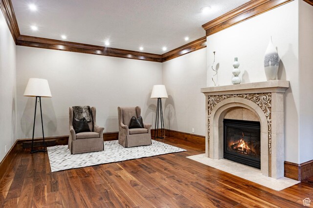 2177 W 9240 S, West Jordan, UT 84088 - sitting room with a tile fireplace, wood finished floors, ornamental molding, baseboards, and recessed lighting