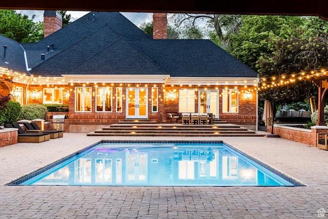 2177 W 9240 S, West Jordan, UT 84088 - outdoor pool featuring exterior kitchen, a patio area, and french doors