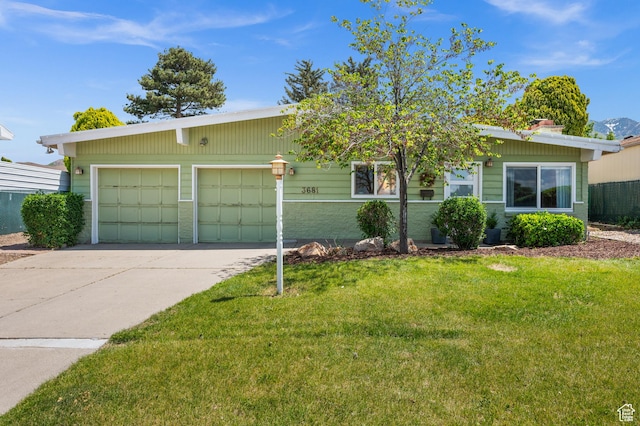 3681 S Terrace Heights Rd, Millcreek, UT 84109 - view of front of property featuring driveway, a front yard, and an attached garage