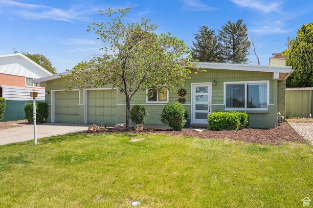 3681 S Terrace Heights Rd, Millcreek, UT 84109 - view of front of home with concrete driveway, a front lawn, an attached garage, and a chimney