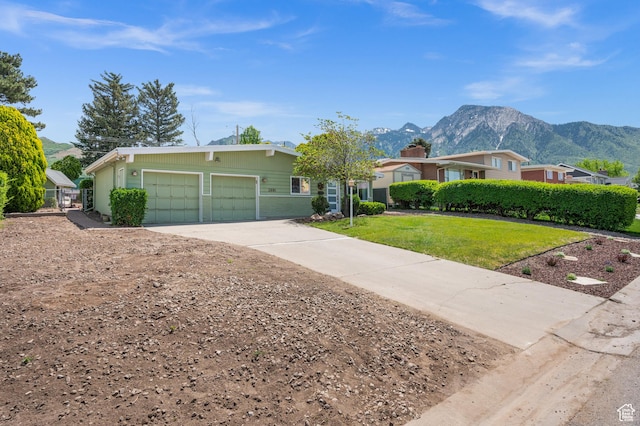 3681 S Terrace Heights Rd, Millcreek, UT 84109 - single story home with a mountain view, a garage, driveway, and a front lawn
