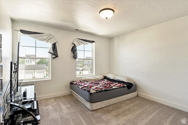 4359 W 200 N, West Point, UT 84015 - carpeted bedroom with a textured ceiling and baseboards