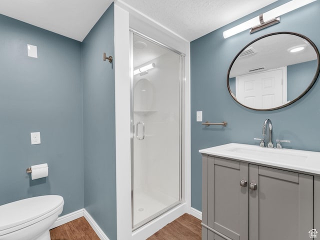 2811 S Filmore St, Salt Lake City, UT 84106 - full bath featuring wood finished floors, baseboards, a shower stall, vanity, and toilet