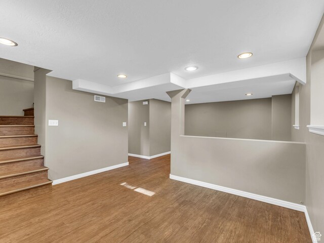 2811 S Filmore St, Salt Lake City, UT 84106 - finished below grade area featuring baseboards, wood finished floors, stairs, and recessed lighting