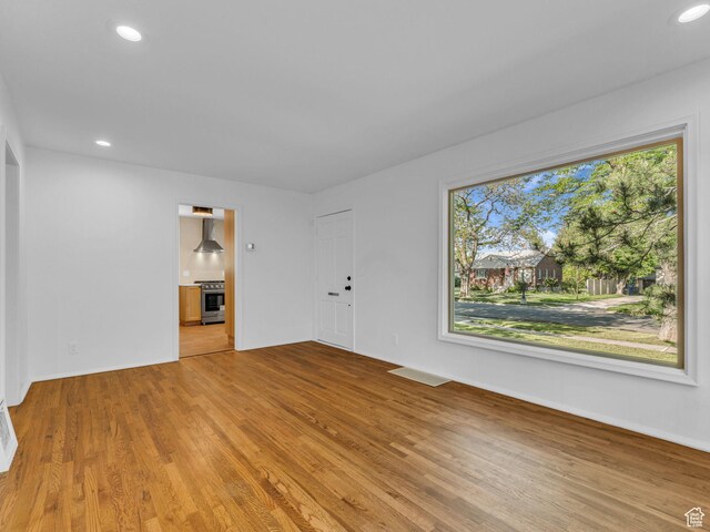 2811 S Filmore St, Salt Lake City, UT 84106 - unfurnished living room featuring light wood-type flooring, recessed lighting, and baseboards