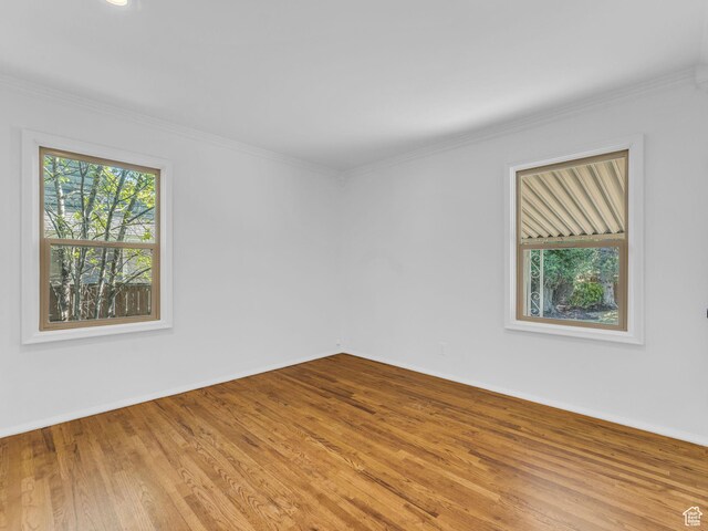 2811 S Filmore St, Salt Lake City, UT 84106 - spare room featuring wood finished floors, baseboards, and ornamental molding