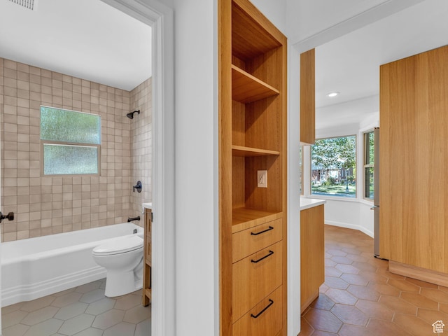 2811 S Filmore St, Salt Lake City, UT 84106 - bathroom featuring tile patterned flooring, toilet, bathing tub / shower combination, vanity, and recessed lighting