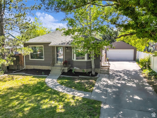 2811 S Filmore St, Salt Lake City, UT 84106 - view of front facade featuring a shingled roof, concrete driveway, and an outdoor structure