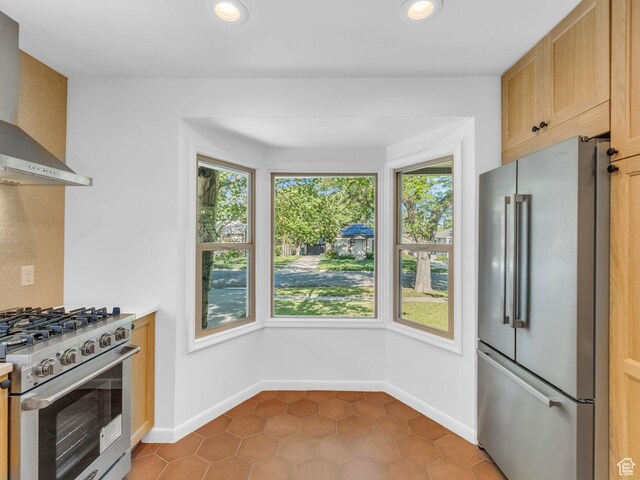 2811 S Filmore St, Salt Lake City, UT 84106 - kitchen featuring high quality appliances, wall chimney exhaust hood, tile patterned floors, recessed lighting, and baseboards