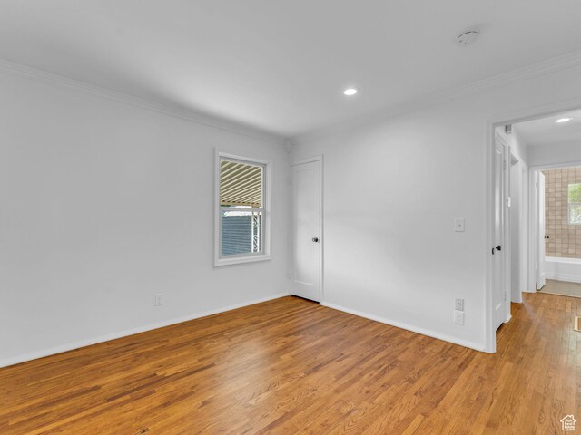 2811 S Filmore St, Salt Lake City, UT 84106 - spare room featuring crown molding, light wood-style flooring, recessed lighting, baseboards, and a smoke detector