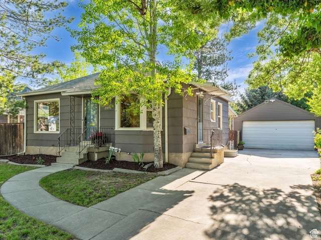 2811 S Filmore St, Salt Lake City, UT 84106 - view of front facade featuring a detached garage, an outdoor structure, and roof with shingles