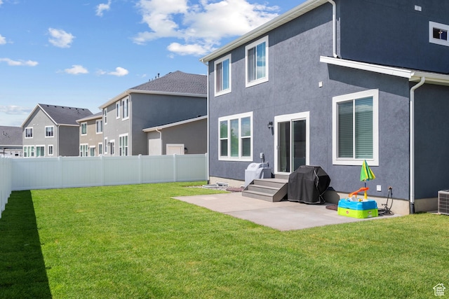 2447 W Santa Fe Dr, Mapleton, UT 84664 - rear view of house with a patio area, stucco siding, central AC, and a residential view