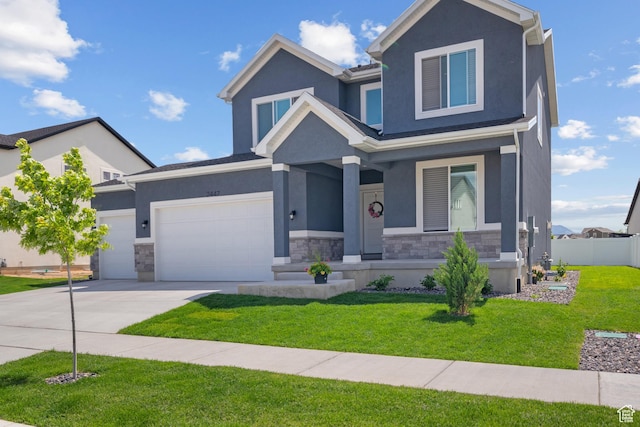 2447 W Santa Fe Dr, Mapleton, UT 84664 - view of front of house featuring stone siding, a porch, concrete driveway, and stucco siding