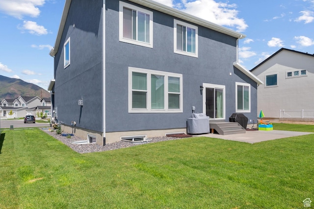 2447 W Santa Fe Dr, Mapleton, UT 84664 - rear view of house with a patio, stucco siding, and a mountain view