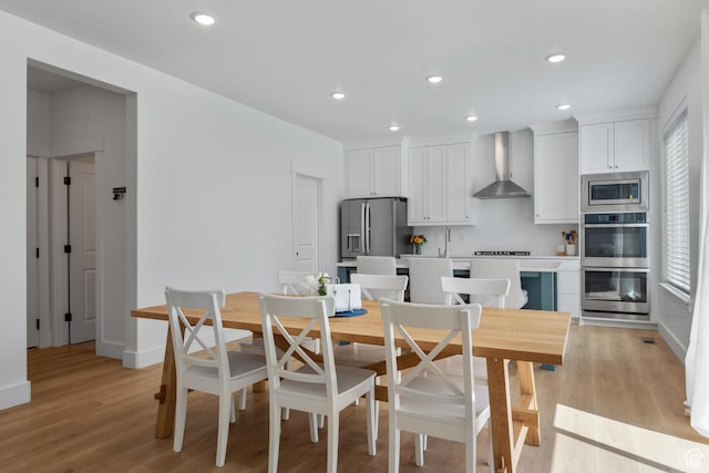 2447 W Santa Fe Dr, Mapleton, UT 84664 - dining space with recessed lighting, light wood-style flooring, and baseboards