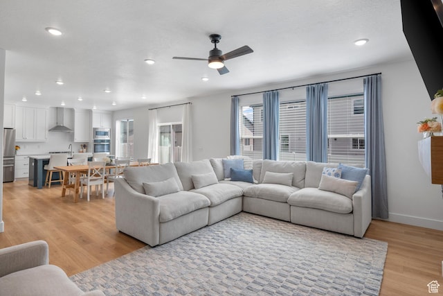 2447 W Santa Fe Dr, Mapleton, UT 84664 - living area with plenty of natural light, light wood finished floors, ceiling fan, and recessed lighting