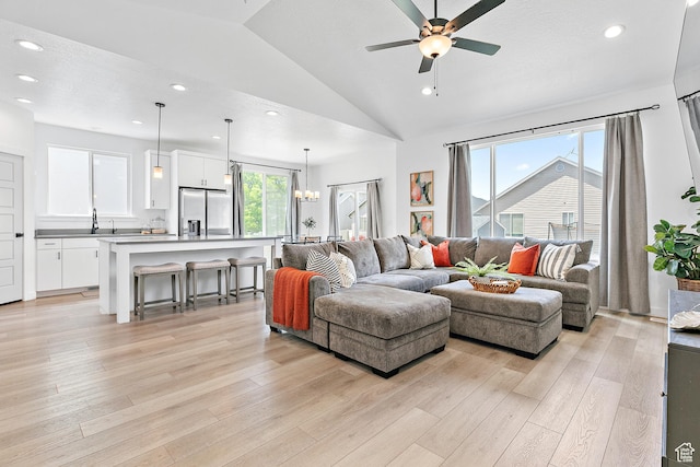 1547 E Cardinal Dr N, Eagle Mountain, UT 84005 - living room with vaulted ceiling, light wood finished floors, ceiling fan, and recessed lighting