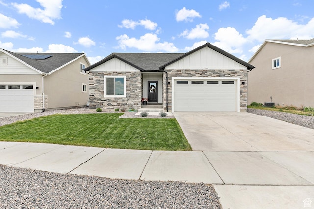 1547 E Cardinal Dr N, Eagle Mountain, UT 84005 - view of front facade with board and batten siding, a garage, driveway, a front lawn, and stone siding