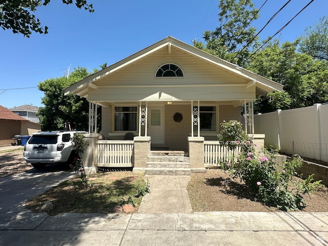 829 E Markea Ave, Salt Lake City, UT 84102 - bungalow-style house featuring covered porch and brick siding