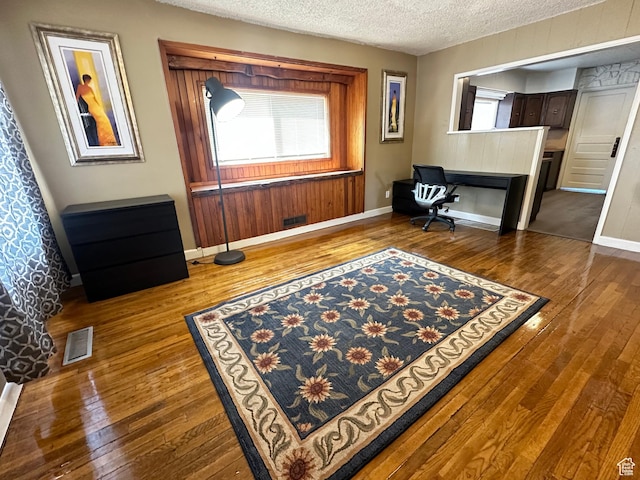 829 E Markea Ave, Salt Lake City, UT 84102 - home office with dark wood-type flooring, a textured ceiling, and baseboards