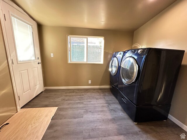 829 E Markea Ave, Salt Lake City, UT 84102 - washroom with washer and clothes dryer, wood finished floors, and baseboards
