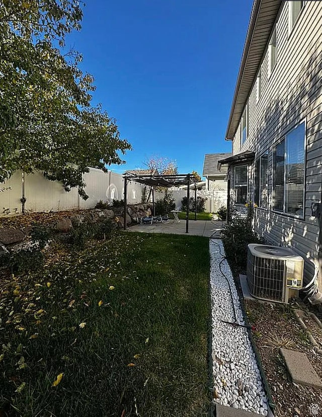 6680 S Leichen Ct, West Jordan, UT 84081 - view of yard with central AC unit, a pergola, and a patio