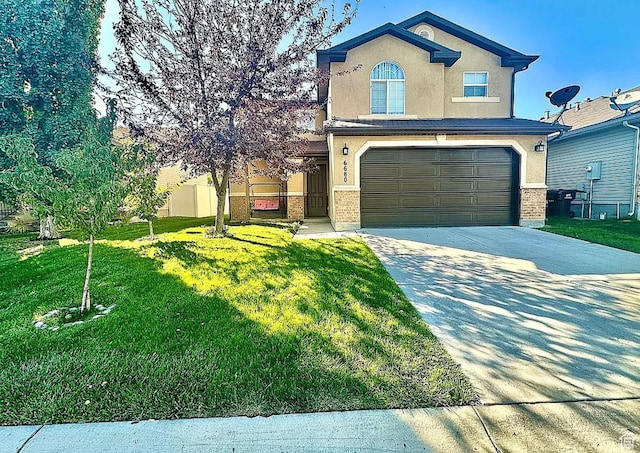 6680 S Leichen Ct, West Jordan, UT 84081 - traditional home featuring stucco siding, concrete driveway, and an attached garage