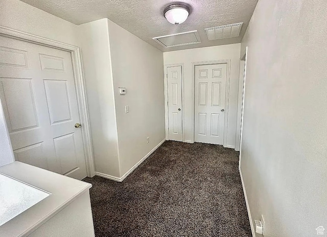 6680 S Leichen Ct, West Jordan, UT 84081 - corridor featuring a textured ceiling, dark colored carpet, and baseboards
