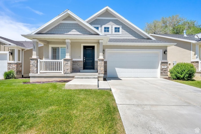 257 N 1125 W, Clearfield, UT 84015 - craftsman house with stone siding, a front yard, an attached garage, concrete driveway, and a porch