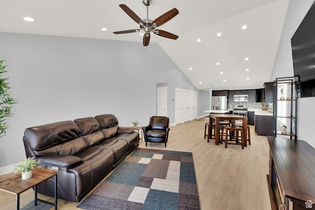 257 N 1125 W, Clearfield, UT 84015 - living room with high vaulted ceiling, a ceiling fan, light wood-style floors, recessed lighting, and baseboards