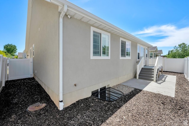 257 N 1125 W, Clearfield, UT 84015 - view of side of property with a fenced backyard, stucco siding, and a patio