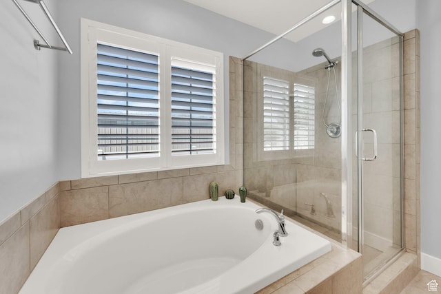 257 N 1125 W, Clearfield, UT 84015 - full bathroom featuring a bath, a stall shower, and healthy amount of natural light