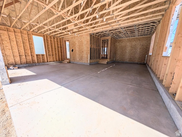 7059 W Granbury Dr S Unit 260, South Jordan, UT 84009 - miscellaneous room featuring concrete floors, healthy amount of natural light, and a garage