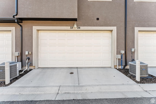 3324 W 3745 S Unit 4065, West Haven, UT 84401 - garage featuring central AC unit and concrete driveway