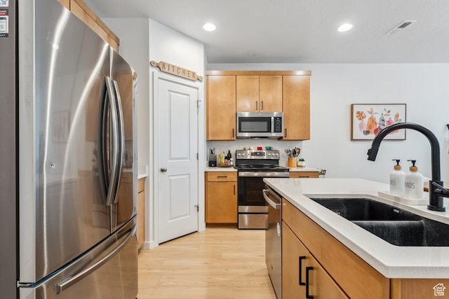 3324 W 3745 S Unit 4065, West Haven, UT 84401 - kitchen featuring appliances with stainless steel finishes, a sink, light wood-style floors, light countertops, and recessed lighting