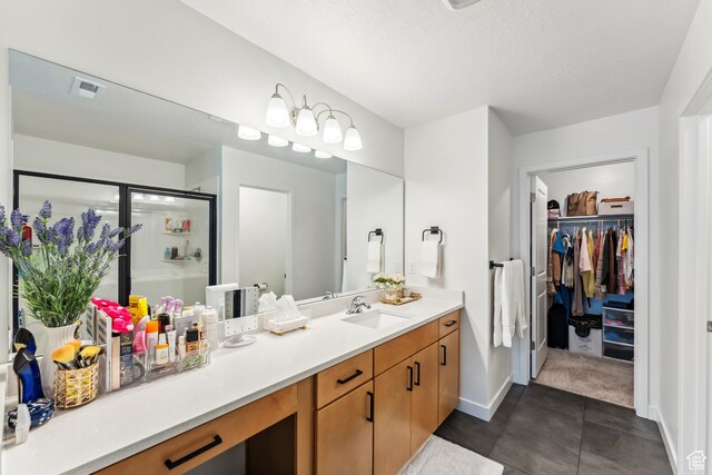 3324 W 3745 S Unit 4065, West Haven, UT 84401 - full bath with vanity, a shower stall, a walk in closet, baseboards, and tile patterned floors