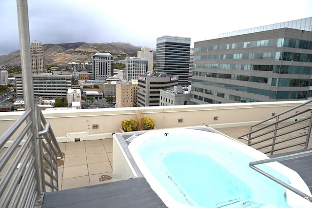 44 W 300 S Unit 1107N, Salt Lake City, UT 84101 - balcony with a jacuzzi, view of pool, a mountain view, and a view of city