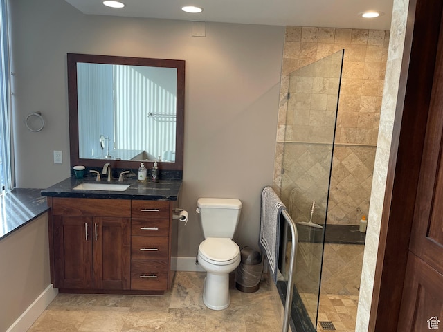 44 W 300 S Unit 1107N, Salt Lake City, UT 84101 - bathroom featuring vanity, a walk in shower, toilet, recessed lighting, and baseboards