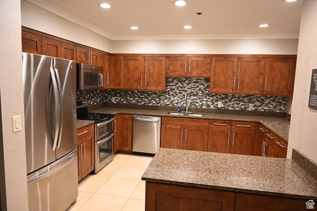 44 W 300 S Unit 1107N, Salt Lake City, UT 84101 - kitchen with appliances with stainless steel finishes, a sink, light tile patterned floors, tasteful backsplash, and dark stone countertops