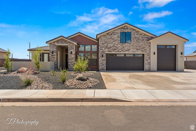 3134 E Blue Heron Dr S, St George, UT 84790 - view of front facade featuring stone siding, concrete driveway, a garage, and stucco siding